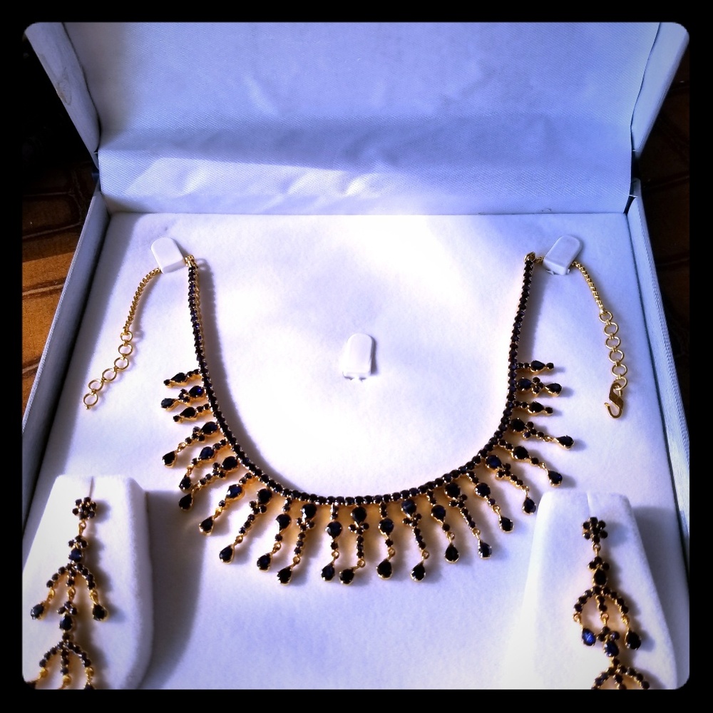 Golden set of earrings and necklace